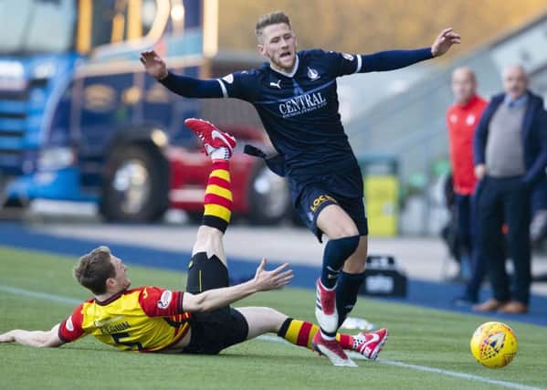 Partick Thistle's Niall Keown challenges Falkirk's Patrick Brough. Pic: SNS/Bruce White