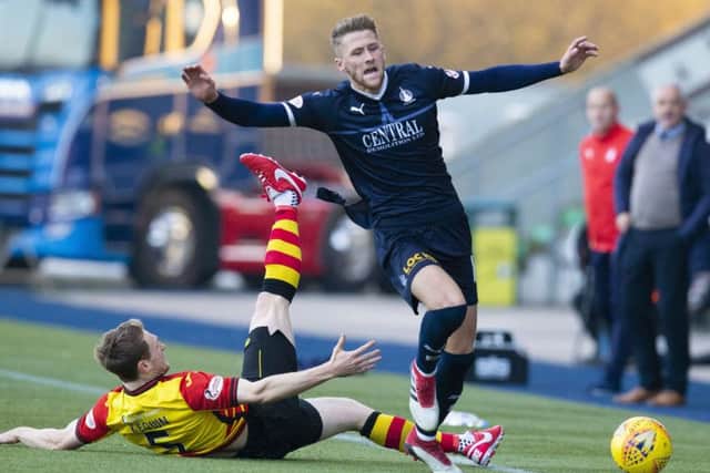 Partick Thistle's Niall Keown challenges Falkirk's Patrick Brough. Pic: SNS/Bruce White