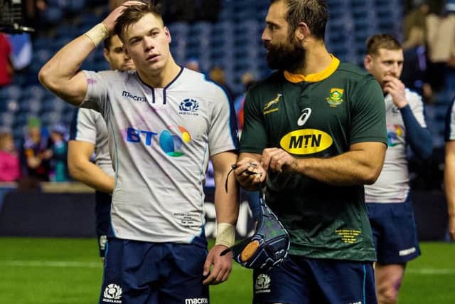 Scotland's Huw Jones and Josh Strauss at full time. Pic: SNS/Ross Parker