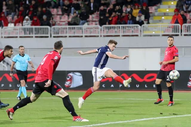 Scotland's James Forrest scores his side's fourth goal of the game. Pic: Adam Davy/PA