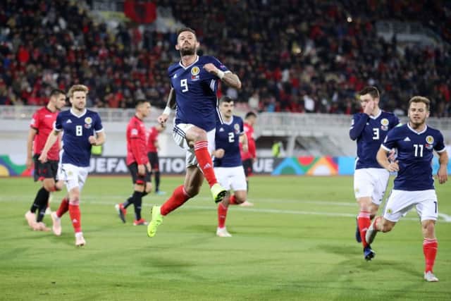 Scotland's Steven Fletcher celebrates scoring his side's second goal. Pic: Adam Davy/PA