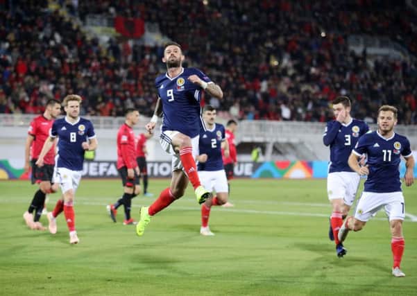 Scotland's Steven Fletcher celebrates scoring his side's second goal. Pic: Adam Davy/PA