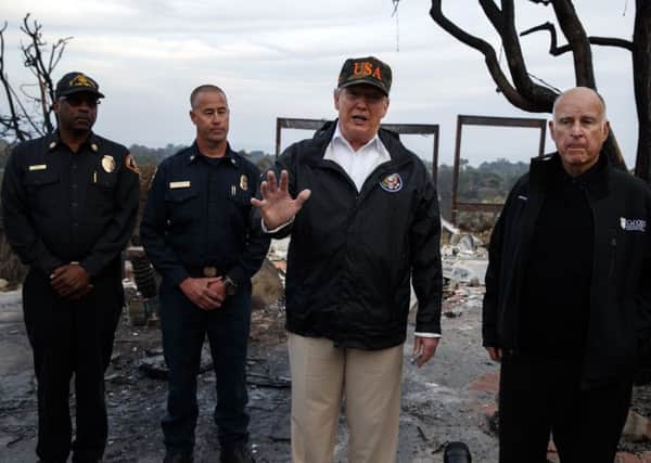 President Donald Trump speaks to the media as he visits a neighborhood impacted by the Wolsey Fire. Picture: AP Photo/Evan Vucci.