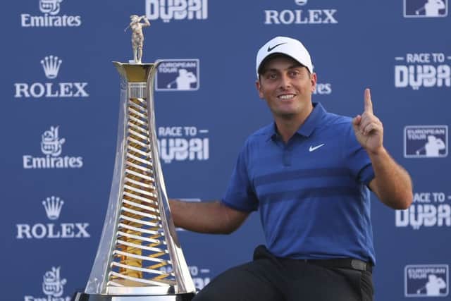 Italy's Francesco Molinari poses with the Race to Dubai trophy. Picture: AP Photo/Kamran Jebreili