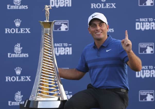 Italy's Francesco Molinari poses with the Race to Dubai trophy. Picture: AP Photo/Kamran Jebreili