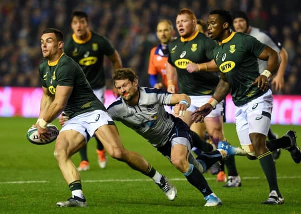 South Africa's Malcolm Max and Scotland's Peter Horne battle for possession. Picture: SNS Group