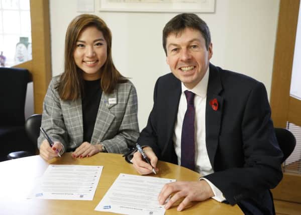 Presiding officer Ken Macintosh MSP and Chair of the SYP Suki Wan MSYP sign a partnership agreement which will see the Scottish Parliament and the Scottish Youth Parliament work more closely with each other. 07 November 2018 . Pic - Andrew Cowan/Scottish Parliament