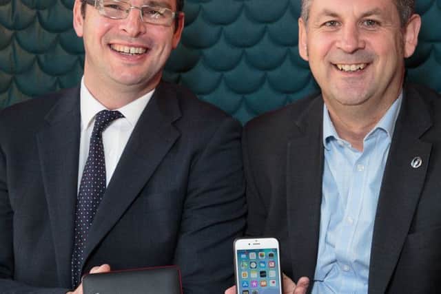 Peter Waggott of Powercases (Scotland), right, with David Robertson, technology solutions manager at Staples Solutions. Picture: Alan S Morrison