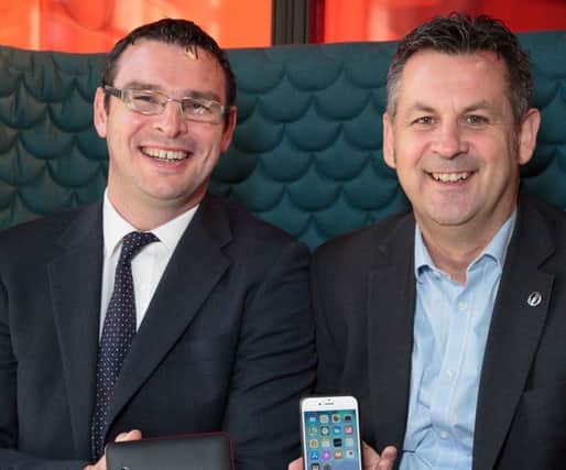 Peter Waggott of Powercases (Scotland), right, with David Robertson, technology solutions manager at Staples Solutions. Picture: Alan S Morrison