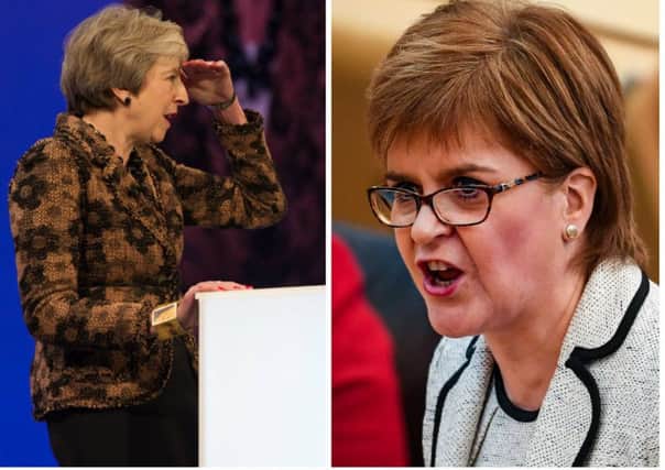Nicola Sturgeon (right) criticised Theresa May's Brexit letter. Picture: PA/AFP