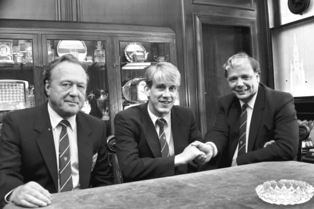 Former Hearts vice-chairman Pilmar Smith, left, with Gary Mackay and former chairman Wallace Mercer, right, in June 1987, after midfielder Mackay had agreed a new contract with the club. Picture: Albert Jordan/The Scotsman