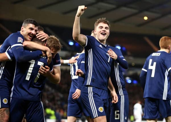 James Forrest celebrates scoring his, and Scotland's third goal. Picture: PA