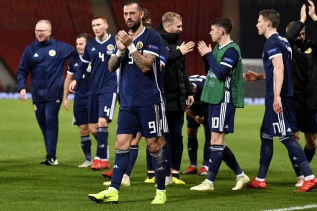 A victorious Scotland squad applauds the fans at full time. Picture: SNS