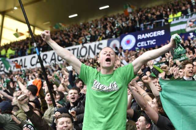 Celtic fans celebrate in the Broomloan Stand after the 3-2 win at Ibrox last season. Picture: SNS