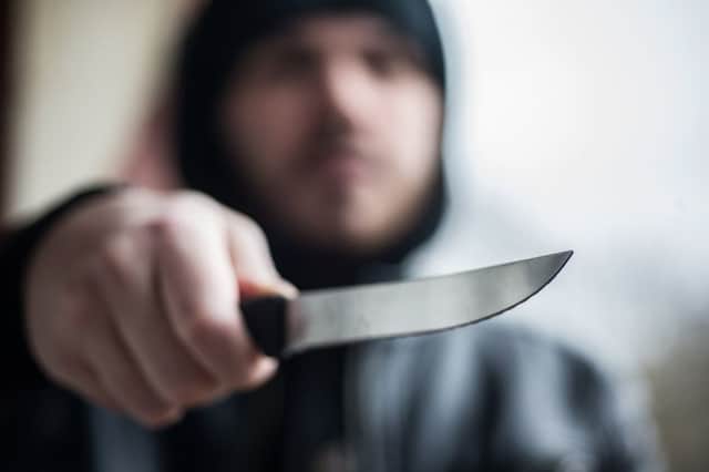 23/01/17 .  GLASGOW. Stock shot of man with knife. knife crime , stab , stabbing, gang , violence.