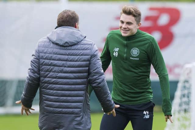 Celtic manager Brendan Rodgers chats with James Forrest during training. Picture: SNS