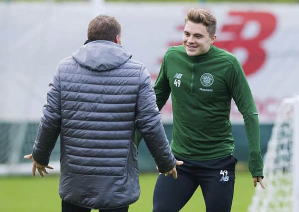 Celtic manager Brendan Rodgers chats with James Forrest during training. Picture: SNS