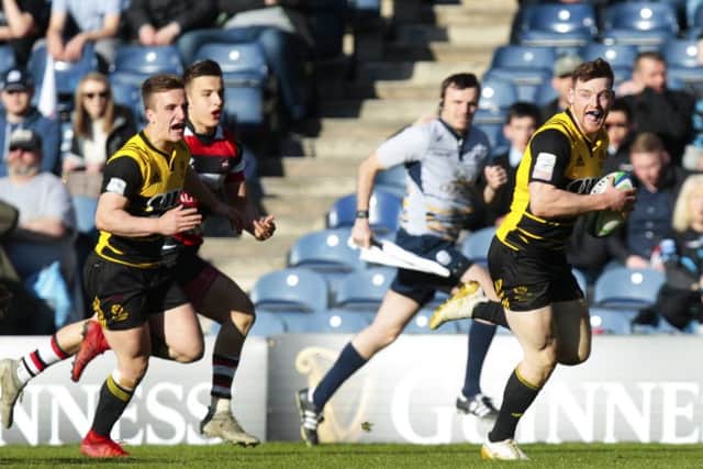 Melrose's George Taylor runs through for a try in last season's Scottish Cup final. Picture: Graham Stuart/SNS