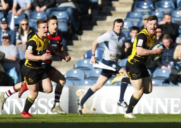 Melrose's George Taylor runs through for a try in last season's Scottish Cup final. Picture: Graham Stuart/SNS