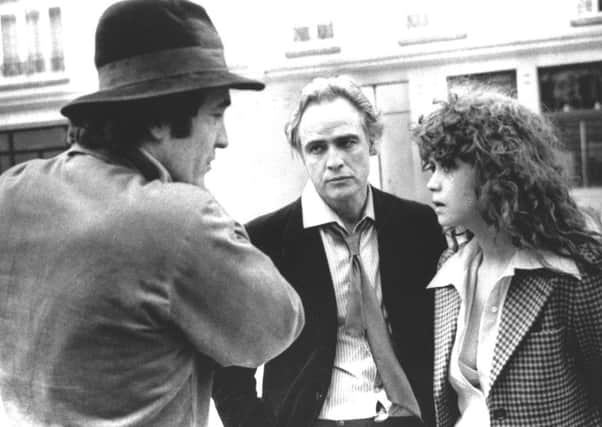 Bernardo Bertolucci, left, with Marlon Brando and Maria Schneider in 1973. Picture: AP