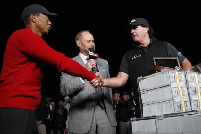 Tiger Woods, left, shakes hands after losing 'The Match' to Phil Mickelson, right, at Shadow Creek in Las Vegas. Picture: AP