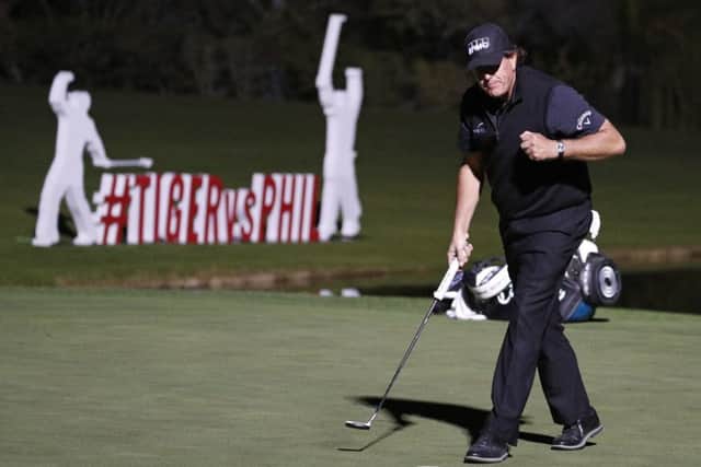 Phil Mickelson celebrates after sinking the winning putt at the fourth extra hole. Picture: AP
