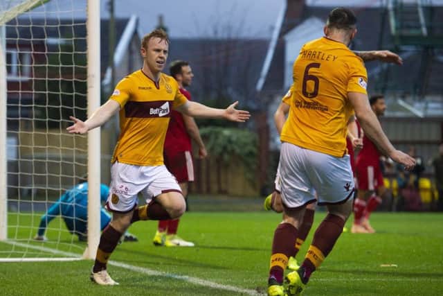 Danny Johnson celebrates after he heads home his second. Pic: SNS/Alan Harvey