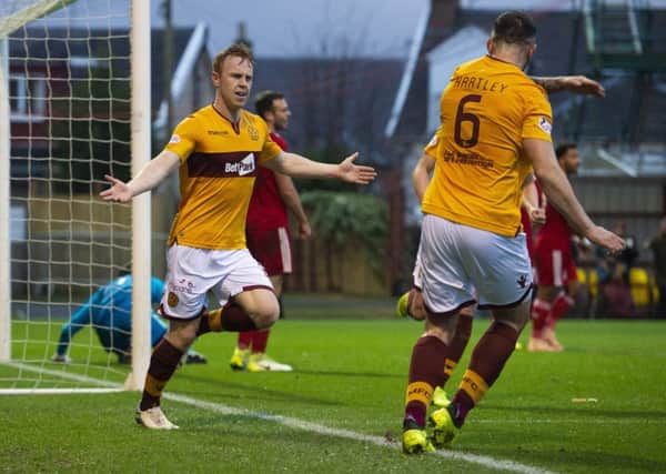 Danny Johnson celebrates after he heads home his second. Pic: SNS/Alan Harvey