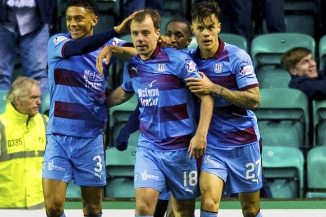 Dundee players celebrate Paul McGowan's equaliser. Pic: SNS/Sammy Turner