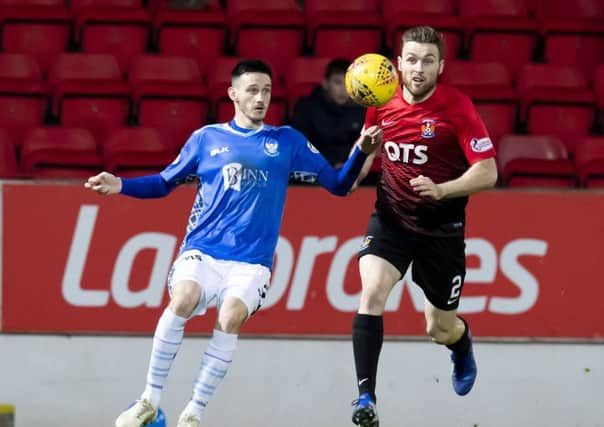 Kilmarnock's Greg Stewart competes with Scott Tanser. Pic: SNS/Kenny Smith