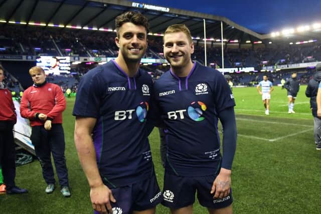 Adam Hastings (left) and Finn Russell celebrate at full time. Pic: SNS/SRU/Gary Hutchison