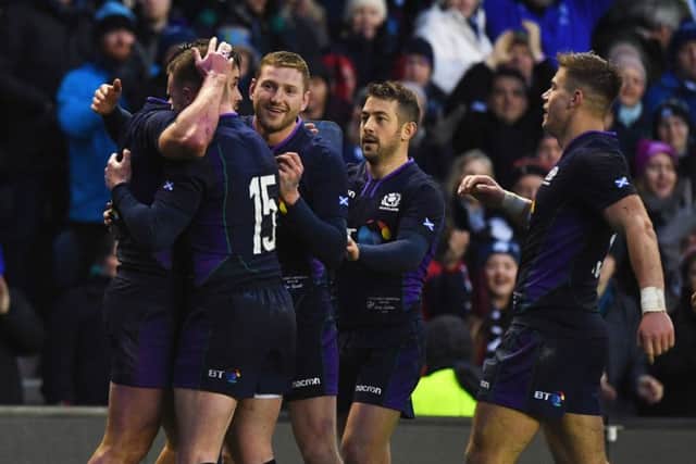 Sean Maitland (L) celebrates with his teammates after scoring. Pic: SNS/Paul Devlin