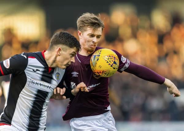 Hearts forward Craig Wighton, right, tussles with St Mirren's Jack Baird during the Tynecastle side's defeat in Paisley. Picture: SNS