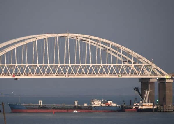 A ship under the the Kerch bridge blocks the passage to the Kerch Strait near Kerch, Crimea (AP Photo)