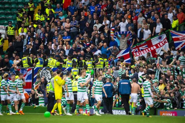 Celtic's players celebrate in front of the away fans after the 1-0 win in September. Picture: SNS