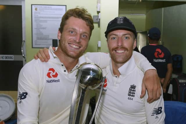 England vice captain Jos Buttler and Jack Leach. Picture: Getty