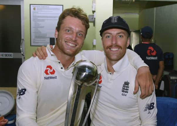 England vice captain Jos Buttler and Jack Leach. Picture: Getty