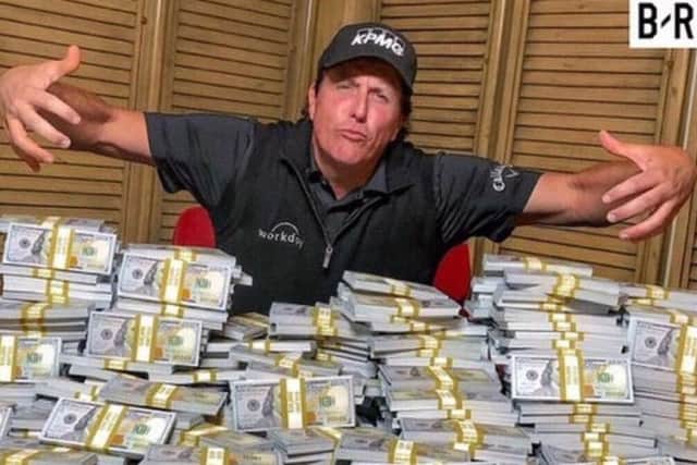 Phil Mickelson with the pot ahead of his match with Tiger Woods.