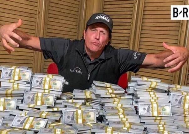Phil Mickelson with the pot ahead of his match with Tiger Woods.