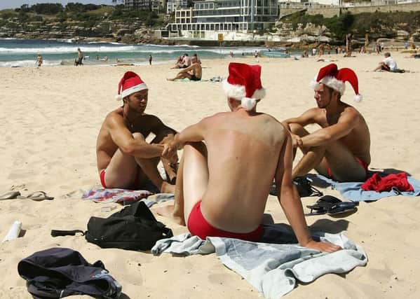 Life's a beach for many people who prefer a warmer Christmas. Photograph: Cameron Spencer/Getty Images