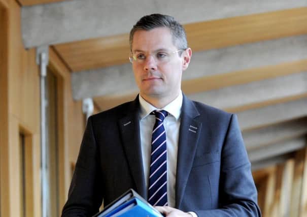 Derek Mackay delivers his statement regarding business rates/income tax at Scottish Parliament today. Picture: Lisa Ferguson.