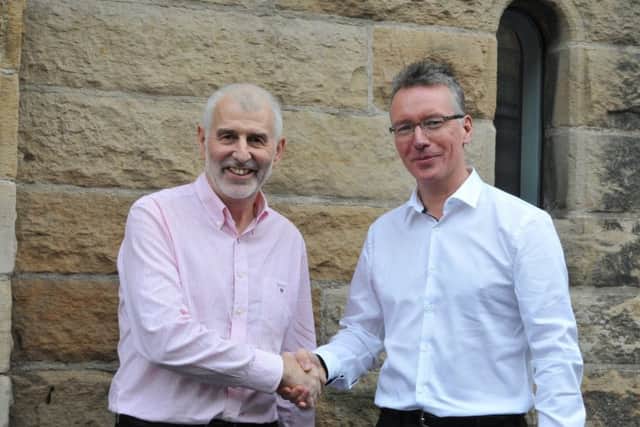 Change of roles: Bill Duguid (left) and Mark Robertson. Picture: Contributed