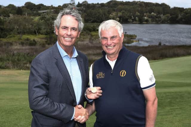 Ian Baker-Finch returns the Gold Medal from his victory in the Open at Royal Birkdale in 1991 to Clive Brown, chairman of the professional events committee at The R&A. Picture: The R&A/Getty Images