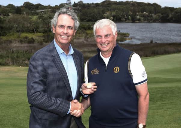 Ian Baker-Finch returns the Gold Medal from his victory in the Open at Royal Birkdale in 1991 to Clive Brown, chairman of the professional events committee at The R&A. Picture: The R&A/Getty Images