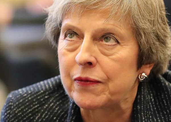 Theresa May's Brexit plan is forecast to damage the UK economy but by nowhere near as much as a no-deal Brexit (Picture: Liam McBurneyAFP/Getty Images)