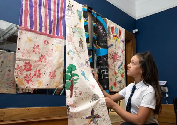 National Museums Scotland and Culture Perth & Kinross Community Art Project at Perth Museum and Art Gallery&Artist Jill Skulina working with local community groups have created a Japanese-style robe. Pictured 13 year old Samira al-Barwani a pupil from Perth High School who helped to create the Kimono. Picture by Graeme Hart.