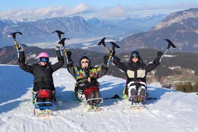 Disability snowsport skiers on a trip abroard