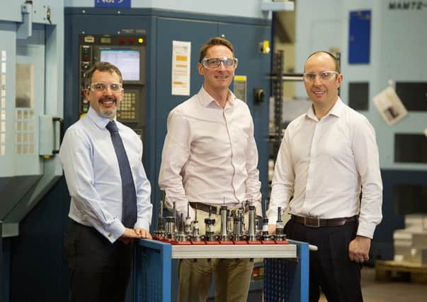 Walker Precision Engineering's Gary (left) and Mark Walker (right) with Paddy Graham from Business Growth Fund (centre). Picture: Peter Sandground