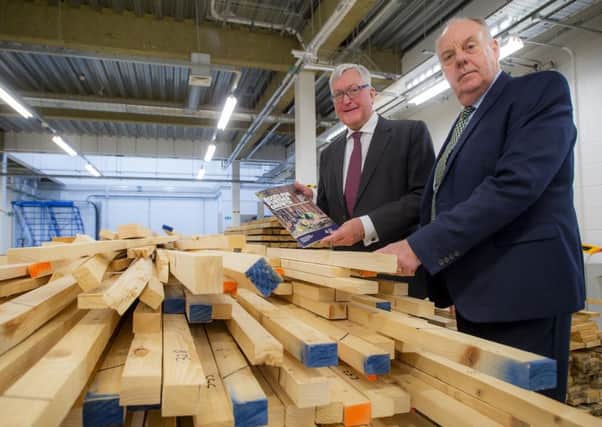 Rural economy secretary Fergus Ewing (left) and Industry Leadership Group chair Martin Gale launch the forestry industries strategy at Edinburgh Napier University. Picture: Alan Peebles