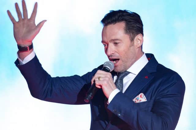 Hugh Jackman performs at a premiere for The Greatest Showman